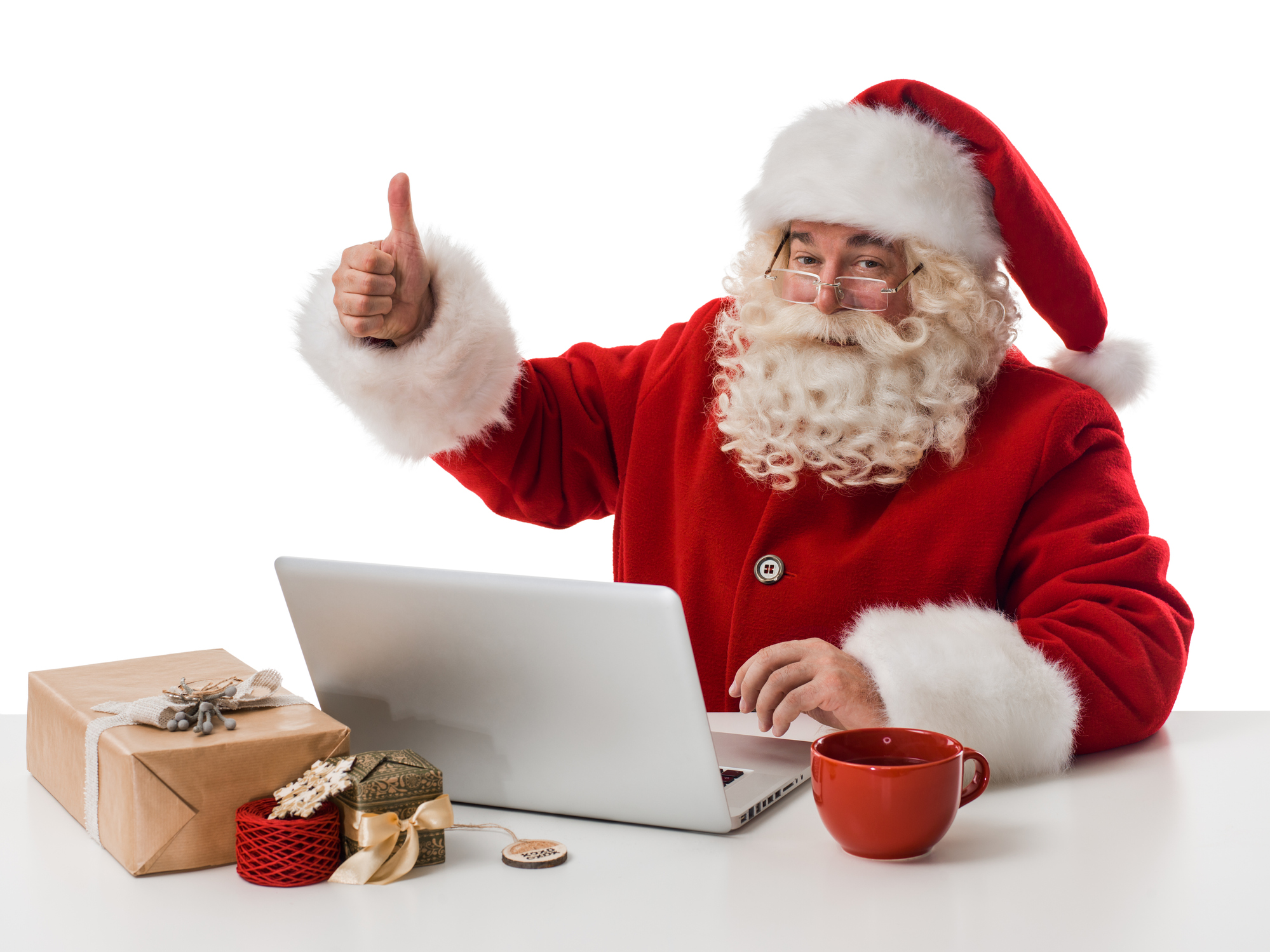 Santa Claus working with laptop