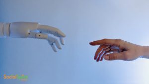 human hand reaching for robot hand